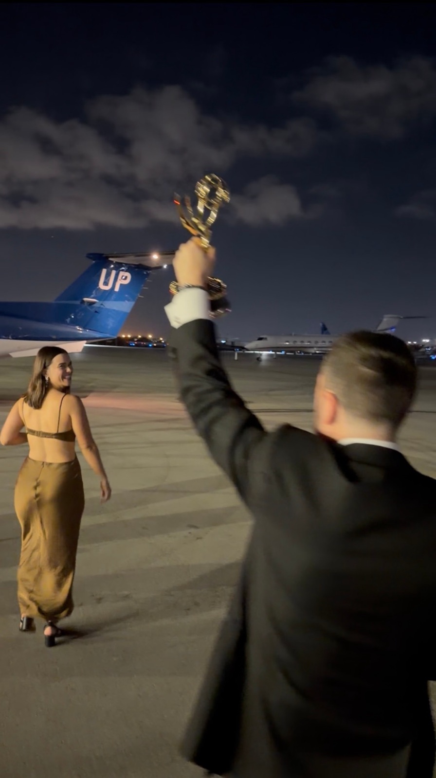 Raising the Emmy on the tarmac after the ceremony